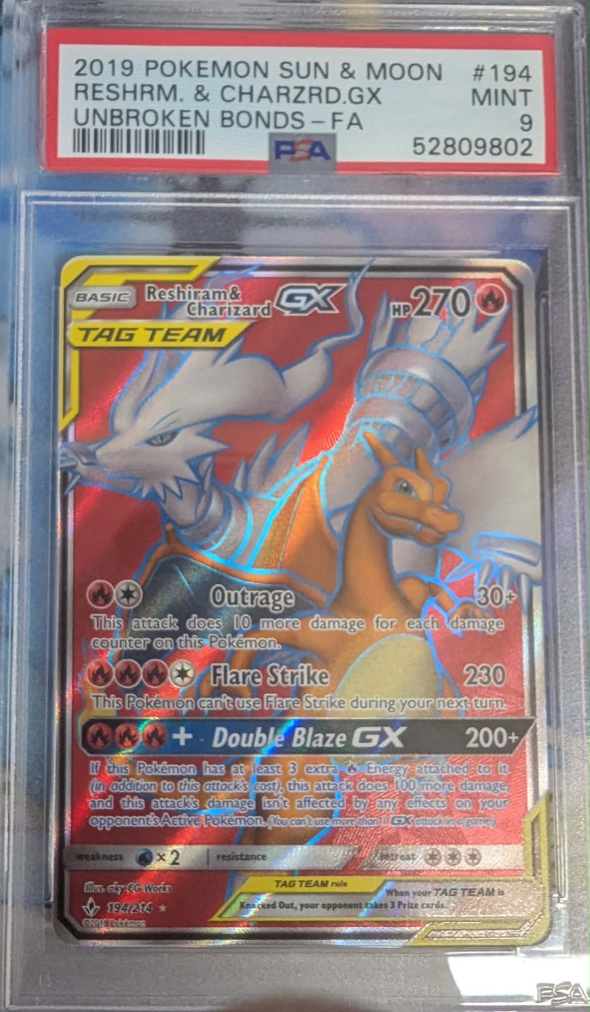 PSA 9 - Unbroken Bonds - Rechiram & Charizard GX #194